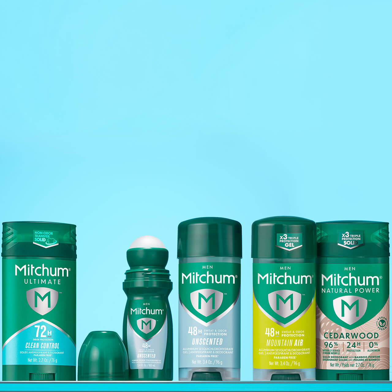 Collection of Mitchum Men's antiperspirant and deodorant products including 72 Hour Ultimate Protection and 48 Hour Sweat & Odor Protection products on a blue background